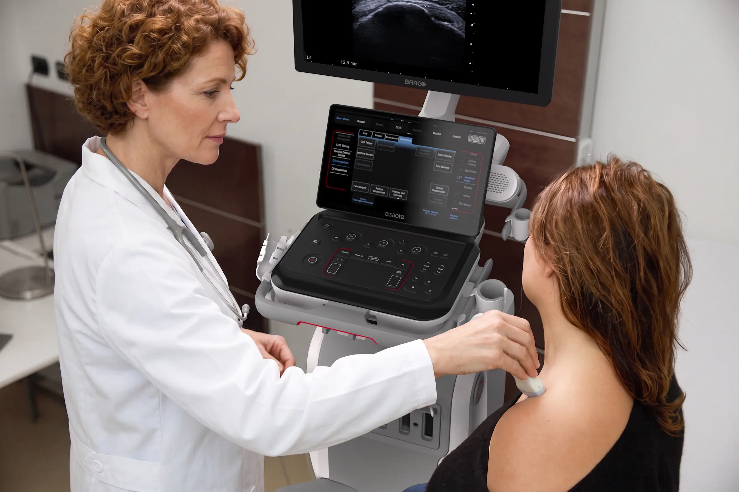 A physician performs a neck ultrasound examination with an Esaote MyLab system
